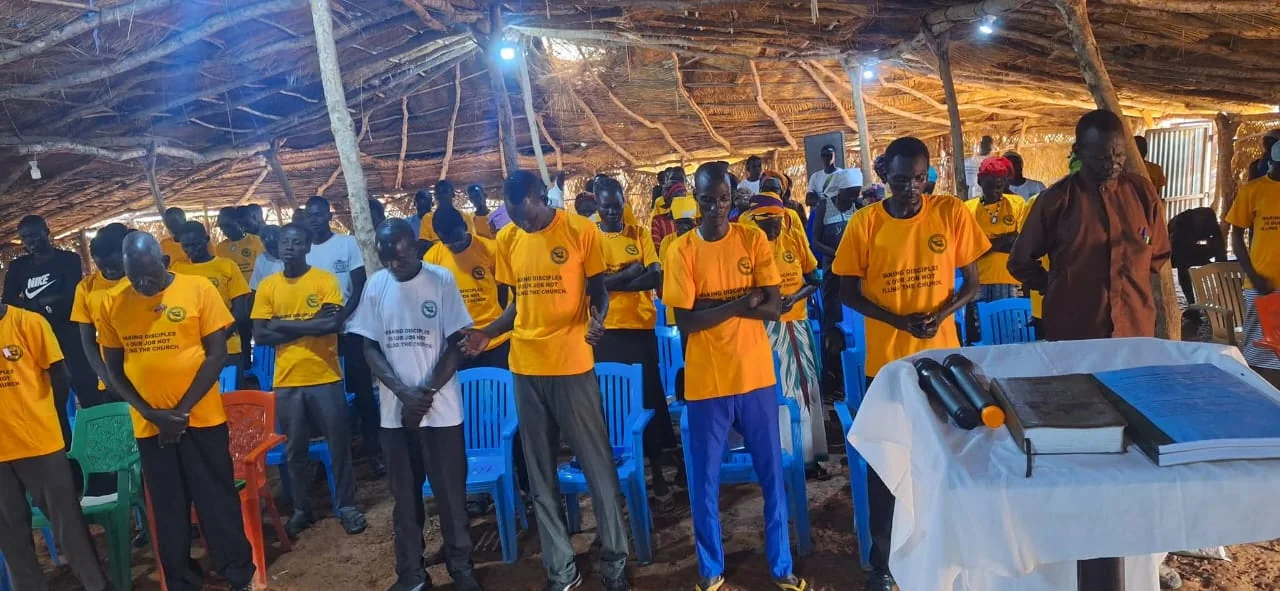 Community members standing together during a ministry gathering